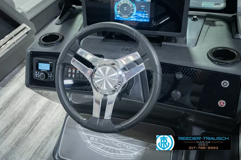Slide: The Image of Steering wheel and dashboard of 2027 Bennington 22 MSB boat with modern controls. - 40