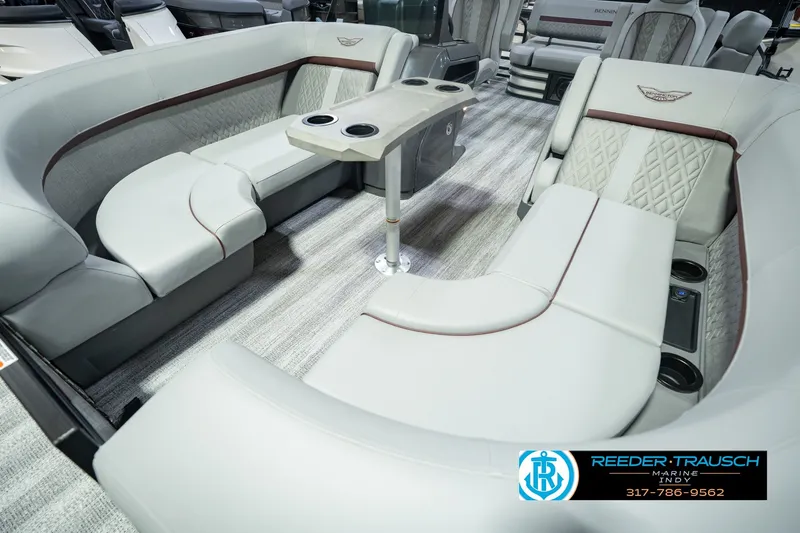 Slide: The Image of Luxurious seating area inside a 2027 Bennington 22 MSB pontoon boat with elegant upholstery. - 13
