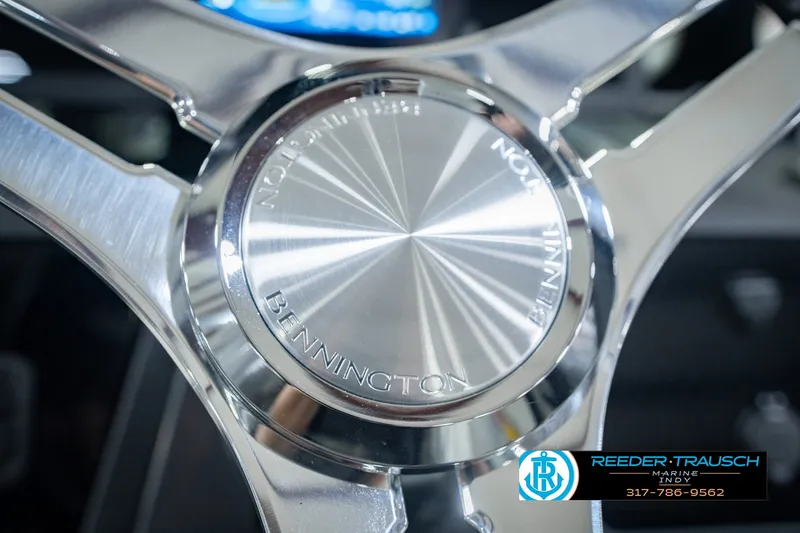 Slide: The Image of Close-up of 2027 Bennington 22 MSB steering wheel with Reeder-Trausch Marine logo. - 42