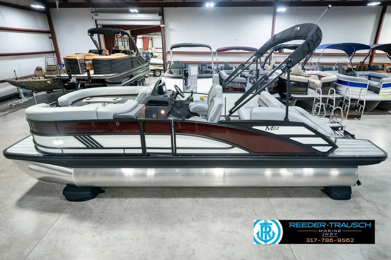 The Image of 2027 Bennington 22 MSB pontoon boat in showroom, side view with canopy. - 0