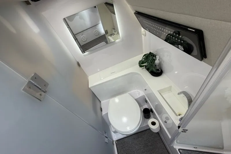 Slide: The Image of Luxurious bathroom interior of 2025 Axopar 37 XC Cross Cabin with modern amenities. - 25