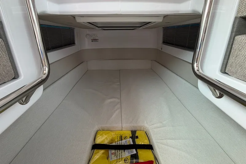 Slide: The Image of Interior cabin of 2025 Axopar 37 XC Cross Cabin with storage compartment. - 24