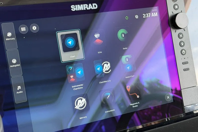 Slide: The Image of Simrad navigation display on 2025 Axopar 37 XC Cross Cabin, showing chart and radar options. - 18