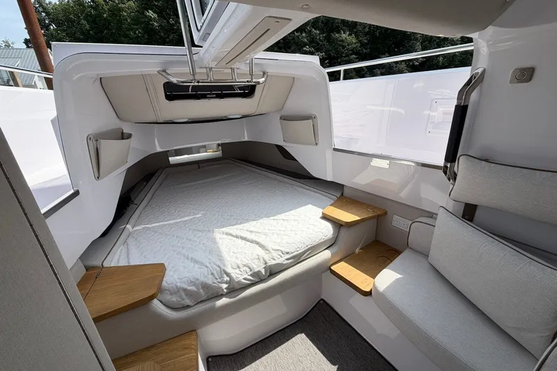 Slide: The Image of Interior cabin of 2025 Axopar 37 XC Cross Cabin with bed and seating. - 20