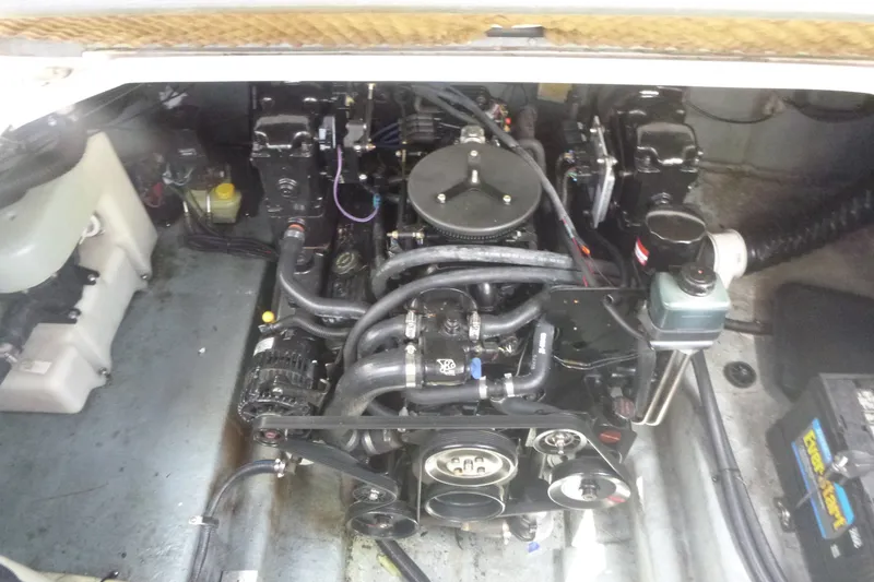 Slide: The Image of Engine compartment of a 2002 Sea Ray Sundancer 260 boat, showcasing mechanical components. - 19