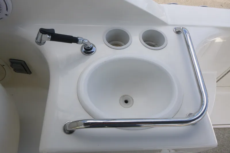 Slide: The Image of Cockpit sink with faucet on 2002 Sea Ray Sundancer 260 boat. - 17