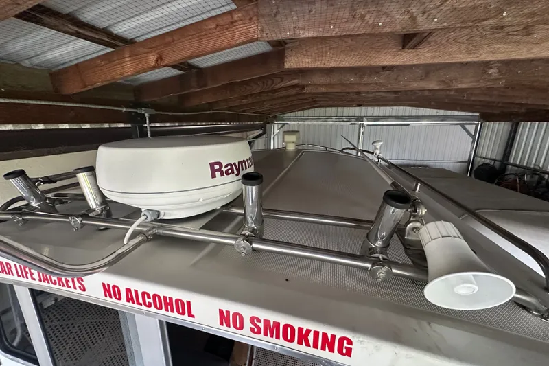 Slide: The Image of Radar equipment on 1999 Orca 24 boat roof, with "No Alcohol, No Smoking" signs. - 12