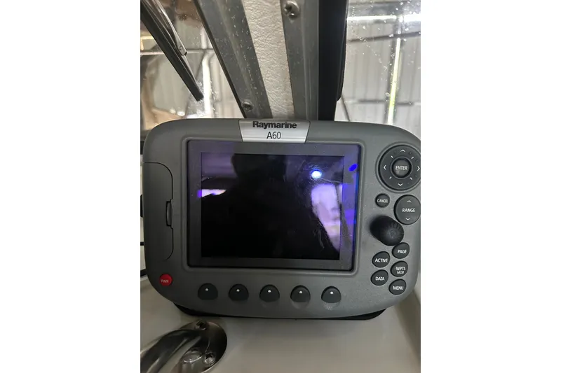 Slide: The Image of Raymarine A60 marine GPS device on 1999 Orca 24 boat dashboard. - 22