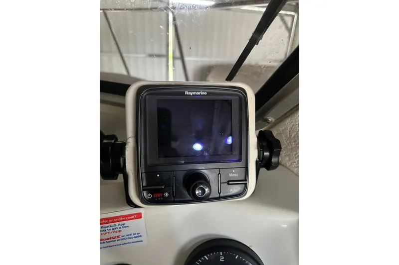 Slide: The Image of Raymarine navigation display on 1999 Orca 24 boat dashboard. - 26