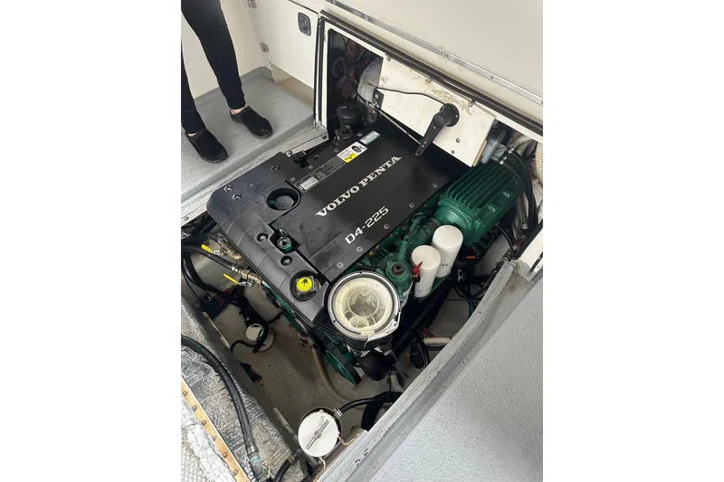 Slide: The Image of Volvo Penta engine in 1999 Orca 24 boat, detailed view of engine compartment. - 14