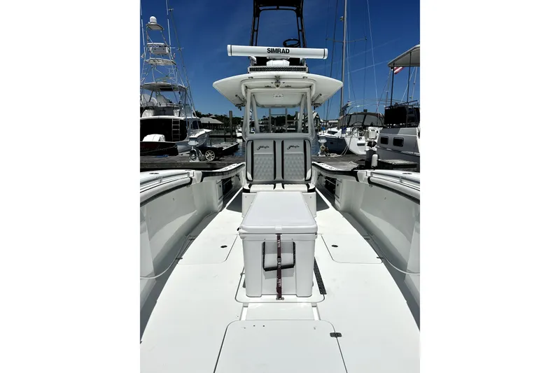Slide: The Image of 2008 Yellowfin 36 Offshore boat interior with seating and equipment, docked at marina. - 11