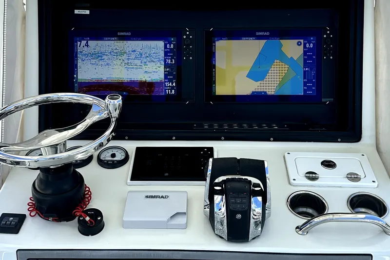 Slide: The Image of Control panel of a 2008 Yellowfin 36 Offshore boat with dual Simrad displays. - 13