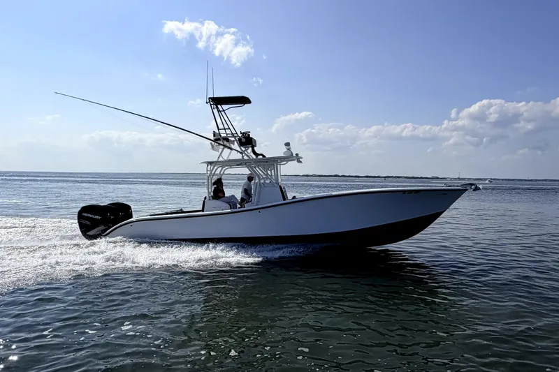 Slide: The Image of 2008 Yellowfin 36 Offshore boat cruising on open water under clear skies. - 6