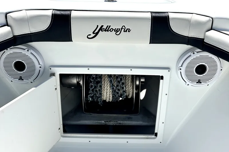 Slide: The Image of 2008 Yellowfin 36 Offshore boat interior with speakers and rope storage compartment. - 10