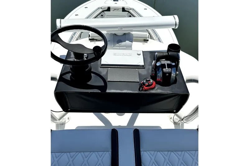 Slide: The Image of 2008 Yellowfin 36 Offshore boat helm with steering wheel and controls. - 19