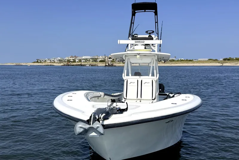 Slide: The Image of 2008 Yellowfin 36 Offshore boat on calm water near shoreline. - 7