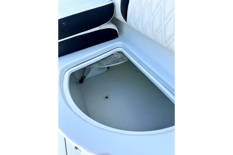 Slide: The Image of Storage compartment on a 2008 Yellowfin 36 Offshore boat, featuring white cushioned seating. - 17