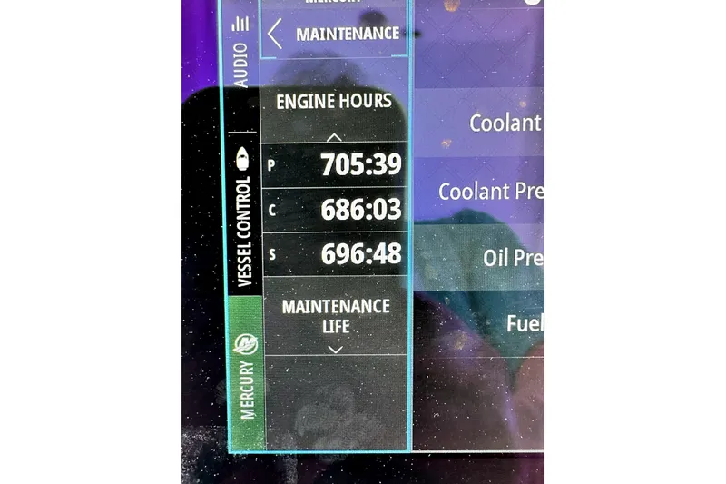 Slide: The Image of Display screen showing engine hours for a 2008 Yellowfin 36 Offshore boat. - 25