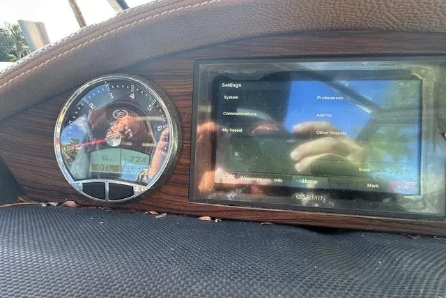 Slide: The Image of Dashboard of a 2016 Cobalt A28 boat with Garmin navigation display. - 60