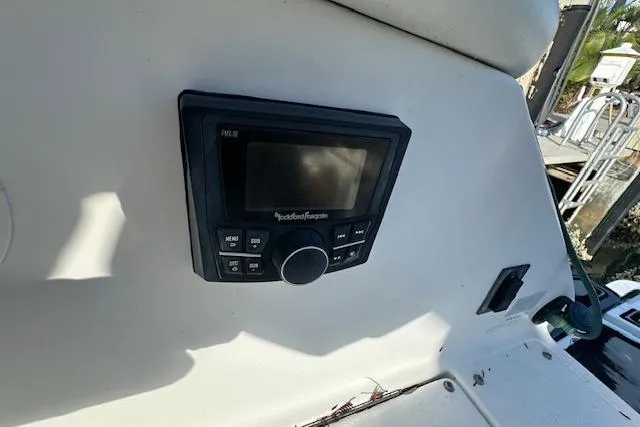 Slide: The Image of Control panel on 2016 Cobalt A28 boat dashboard, featuring Rockford Fosgate system. - 46