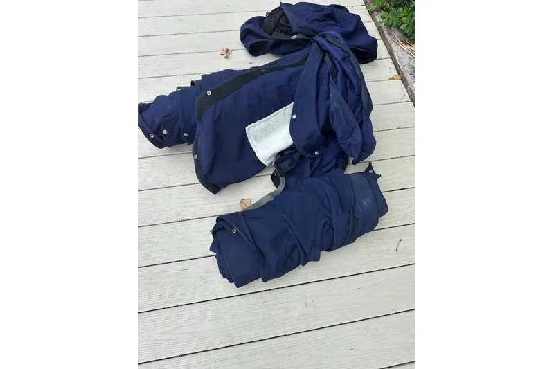 Slide: The Image of Blue fabric on wooden deck, possibly a boat cover for 2016 Cobalt A28. - 29