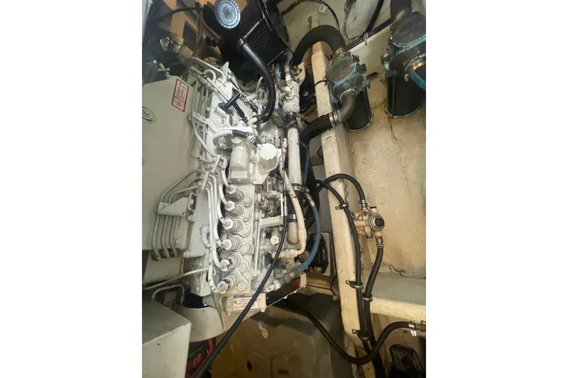 Slide: The Image of Engine compartment of a 1999 Bayliner 4087 Aft Cabin Motoryacht, showcasing mechanical components. - 40