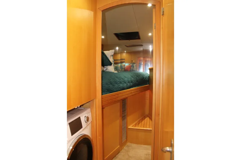 Slide: The Image of Interior of 1997 McKinna 48 Pilothouse with cozy bed and laundry area. - 30