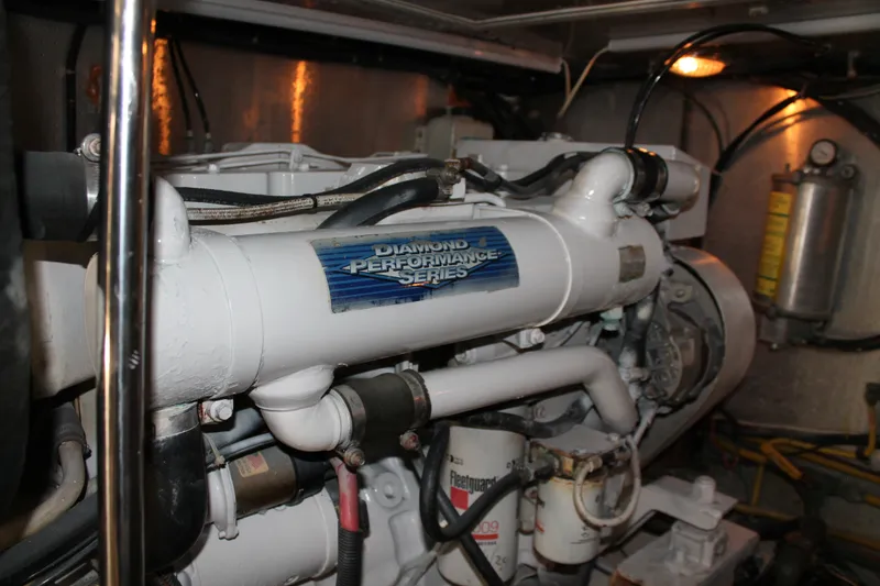 Slide: The Image of Engine room of a 1997 McKinna 48 Pilothouse yacht, featuring Diamond Performance Series engine. - 63