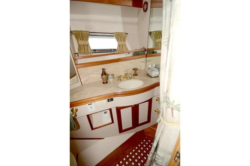 Slide: The Image of Luxurious bathroom interior of 1997 McKinna 48 Pilothouse yacht with elegant fixtures. - 33