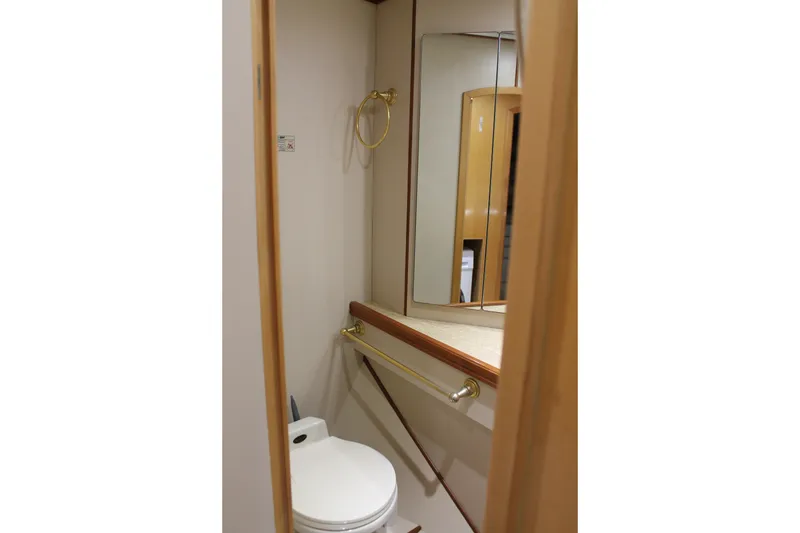 Slide: The Image of Bathroom interior of 1997 McKinna 48 Pilothouse yacht with mirror and toilet. - 66