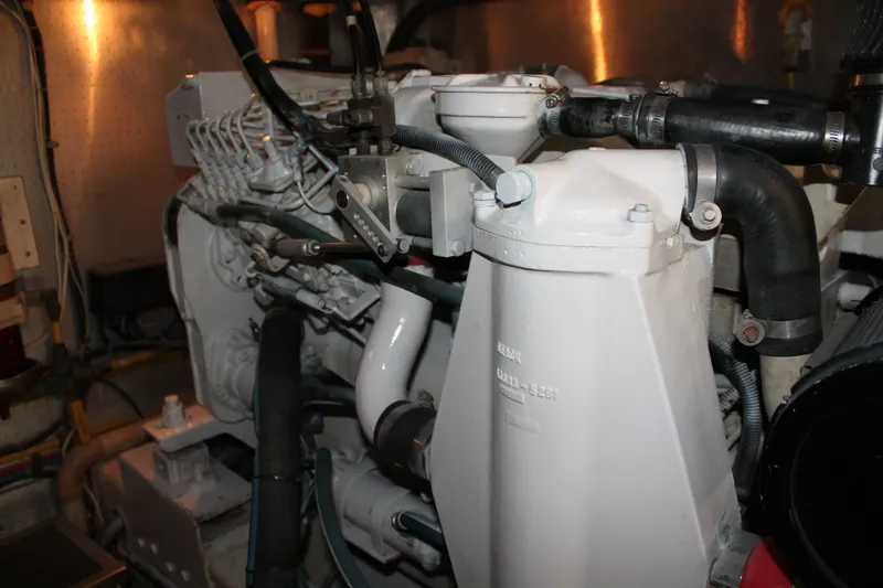 Slide: The Image of Engine room of a 1997 McKinna 48 Pilothouse yacht, showcasing mechanical components. - 61