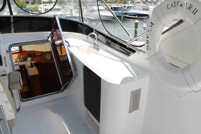 Slide: The Image of 1997 McKinna 48 Pilothouse yacht interior with open hatch and life preserver. - 56