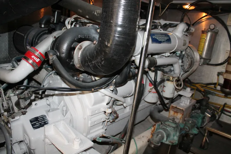 Slide: The Image of Engine room of a 1997 McKinna 48 Pilothouse yacht, showcasing mechanical components. - 60