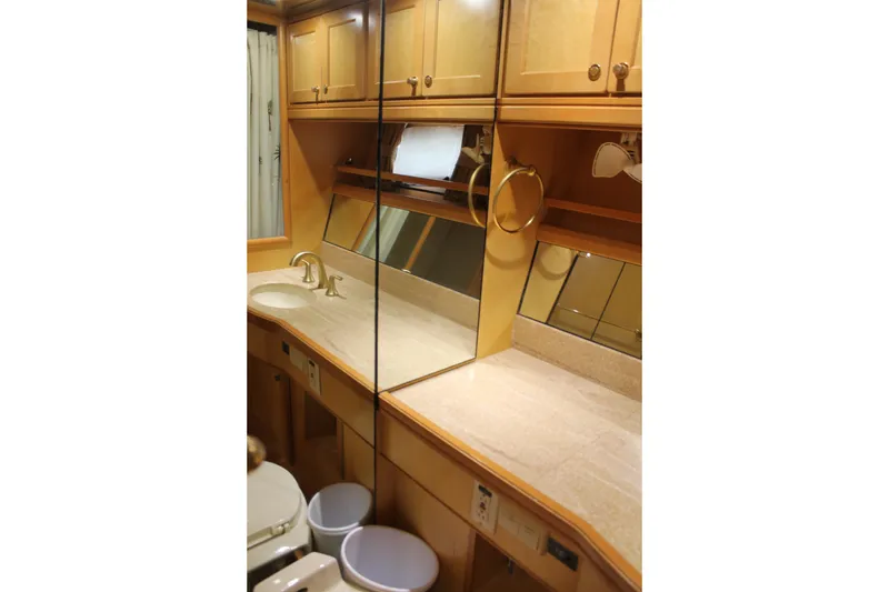 Slide: The Image of Luxurious bathroom interior of 1997 McKinna 48 Pilothouse yacht with wooden cabinetry. - 43