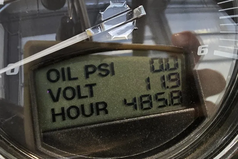 Slide: The Image of Close-up of 2011 Malibu Wakesetter 247 LSV gauge displaying oil PSI, voltage, and hours. - 19