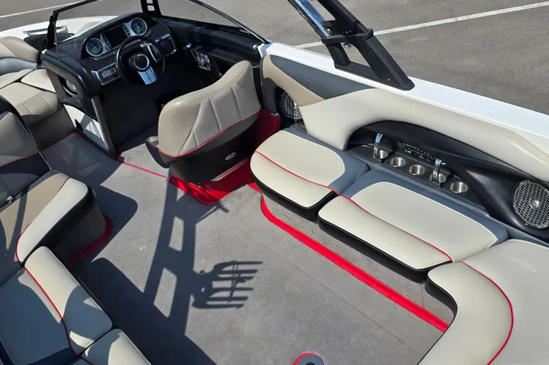 Slide: The Image of 2011 Malibu Wakesetter 247 LSV interior with sleek seating and modern dashboard design. - 13
