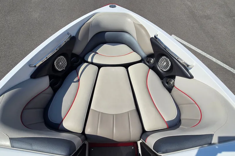 Slide: The Image of 2011 Malibu Wakesetter 247 LSV boat interior with cushioned seating and speakers. - 15
