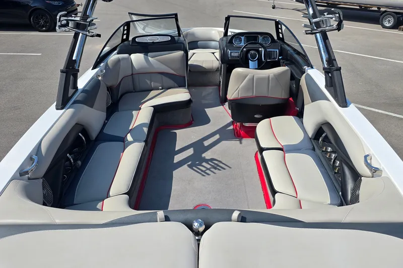 Slide: The Image of 2011 Malibu Wakesetter 247 LSV interior with spacious seating and modern dashboard. - 16