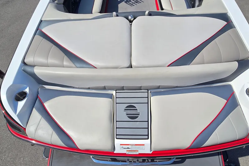 Slide: The Image of 2011 Malibu Wakesetter 247 LSV boat interior with gray and red upholstery. - 9