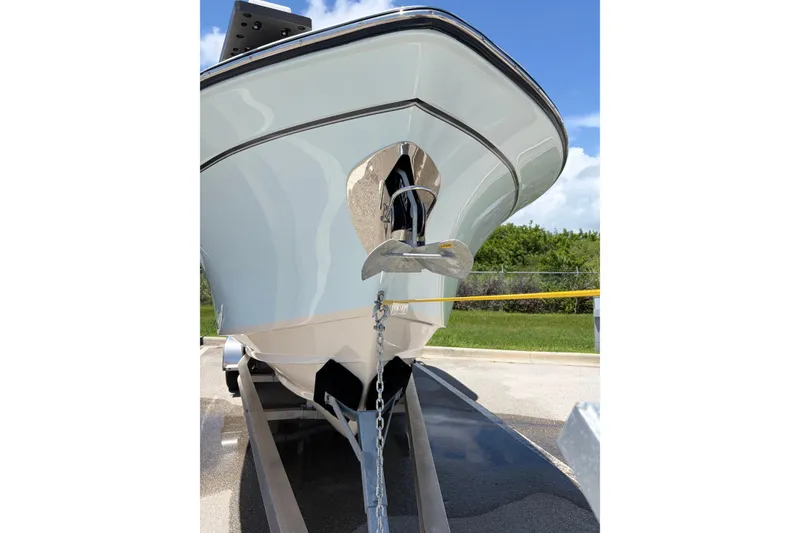 Slide: The Image of 2025 Grady-White Freedom 275 boat on trailer, showcasing sleek hull design. - 1
