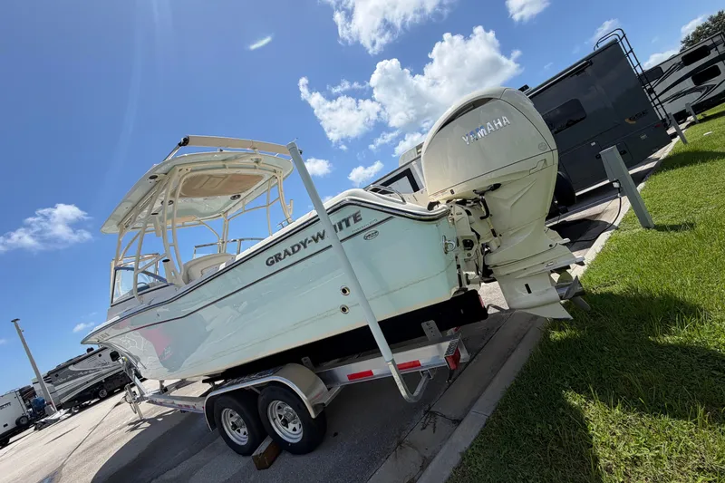 Slide: The Image of 2025 Grady-White Freedom 275 boat on trailer, featuring Yamaha outboard motor. - 3