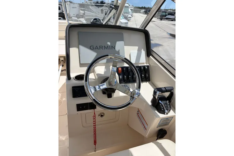 Slide: The Image of 2025 Grady-White Freedom 275 boat helm with Garmin navigation system. - 5