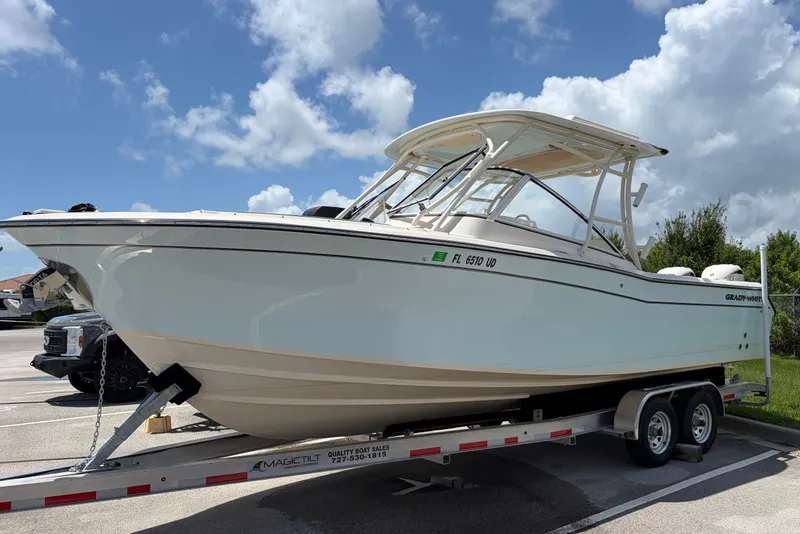 The Image of 2025 Grady-White Freedom 275 boat on trailer under blue sky. - 0