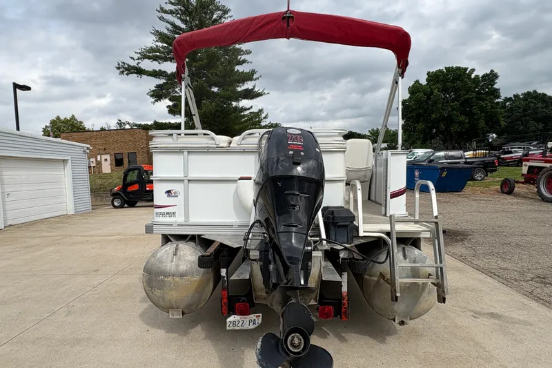 Slide: The Image of 2008 Crest 20 II pontoon boat with red canopy and outboard motor. - 4