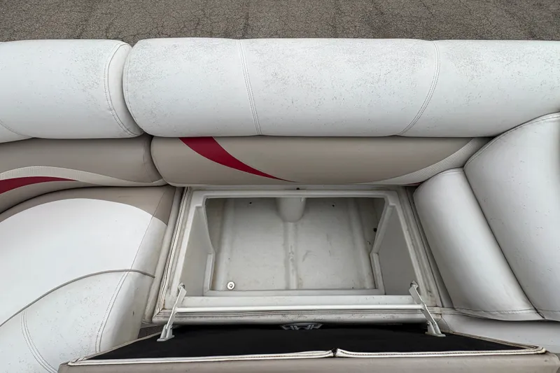 Slide: The Image of Crest 20 II 2008 boat seat storage compartment with white and beige upholstery. - 12