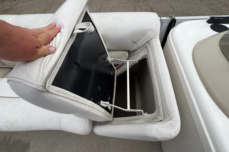 Slide: The Image of White boat seat storage compartment on a 2008 Crest 20 II. - 13