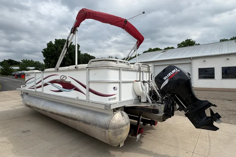 Slide: The Image of 2008 Crest 20 II pontoon boat with Suzuki outboard motor, parked on concrete. - 5