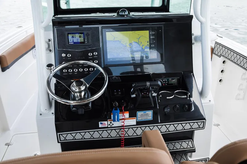 Slide: The Image of Manufacturer Provided Image: 2026 Wellcraft 302 Fisherman boat dashboard with navigation and control systems. - 7