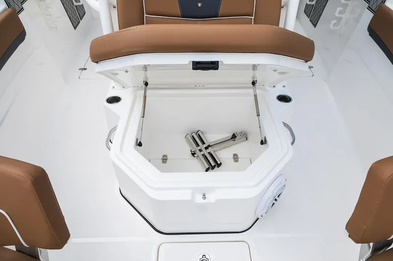 Slide: The Image of Manufacturer Provided Image: 2026 Wellcraft 302 Fisherman boat interior with open storage compartment and brown seating. - 6