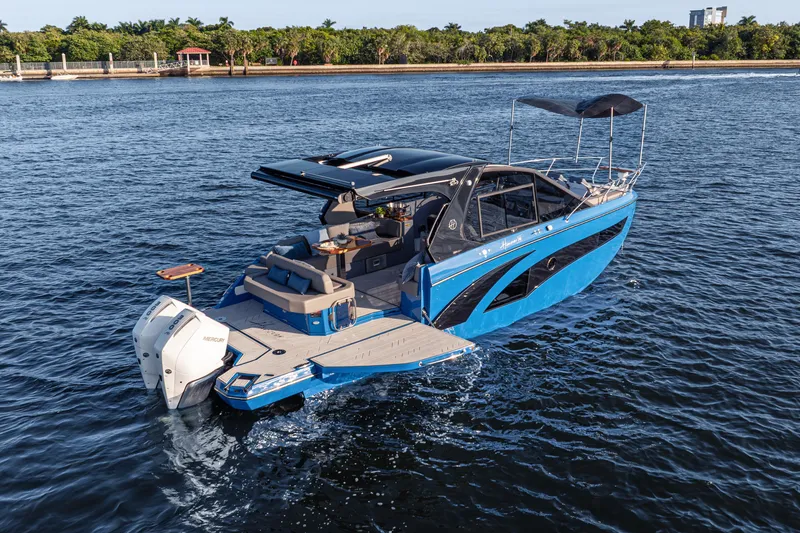Slide: The Image of 2026 Hanover 347 boat cruising on a serene waterway, featuring sleek design and modern amenities. - 6